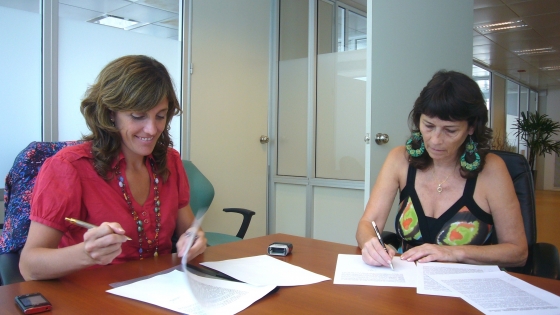 Ottaviano y Colombo firmando acuerdo de cooperación